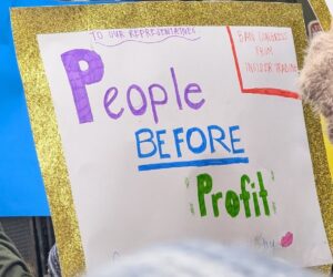 Protest sign displaying: To our representatives people before profit. Ban Congress from insider trading.